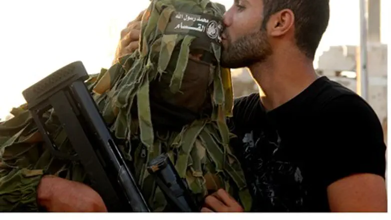 Gaza man kisses Hamas sniper terrorist (file)