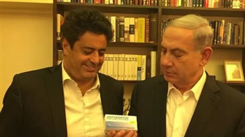 Habib (left) presents PM with 'AntiSemitox'