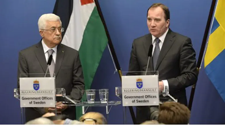 Sweden's Prime Minister Stefan Loefven and PA chairman Mahmoud Abbas in Stockholm