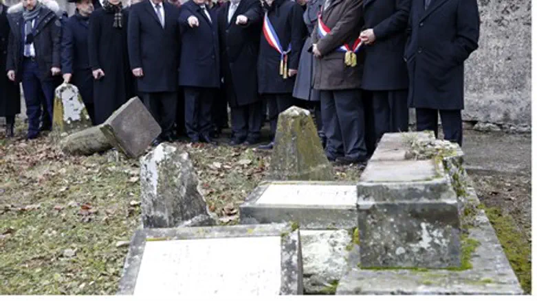 French President Francois Hollande views desecrated Jewish graveyard along with Jewish lea