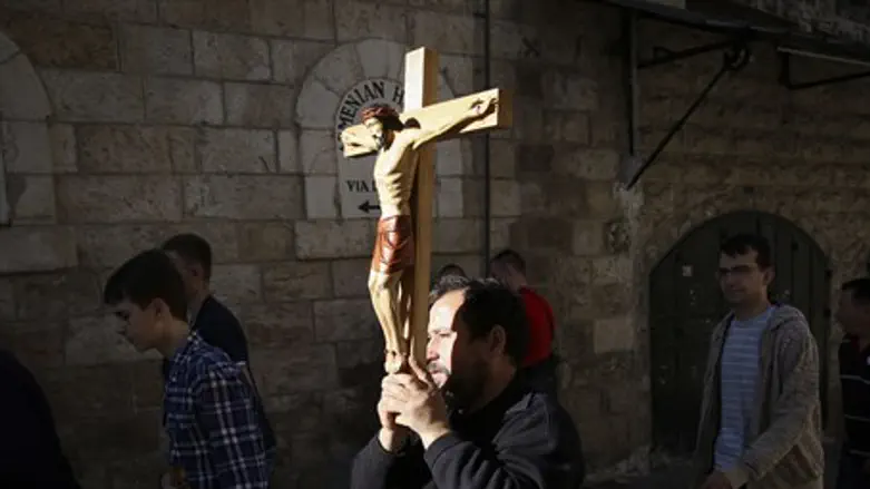 Christians parades a cross in Jerusalem (illustration)