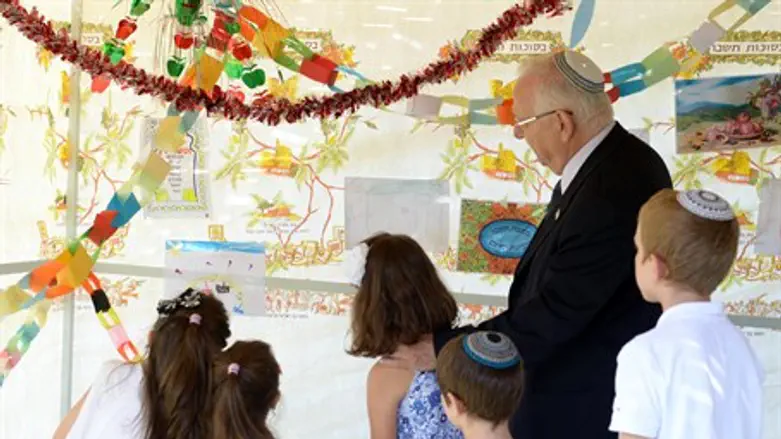 Rivlin and friends decorate 'the Nation's Sukkah'