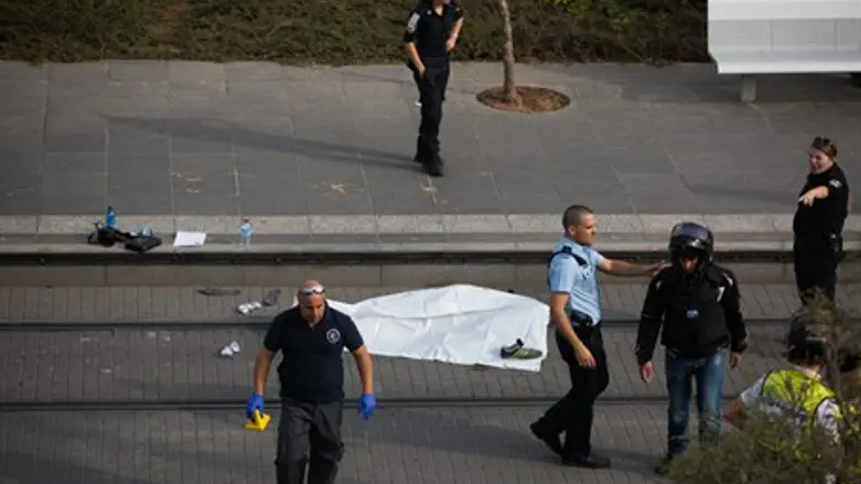 Police surround terrorist's body after Pisgat Ze'ev stabbing