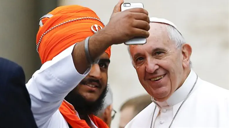 Pope Francis poses for a selfie with a Sikh leader during interreligious audience