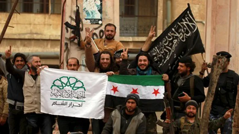 Rebel factions pose with their flags after taking Idlib, Syria (file)