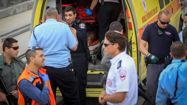 Illustrative: wounded loaded into ambulance after terror attack