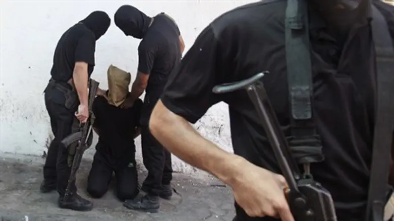 Hamas terrorists prepare to execute a man in Gaza (file)