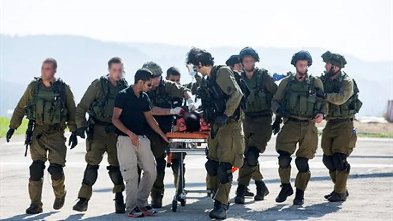 Ashkenazi and Appel being taken to hospital after the car attack