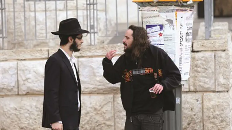 A haredi Jew and a secular Jew talk in Jerusalem