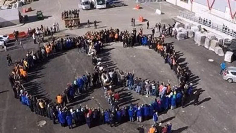 'SodaStream' factory workers form peace sign