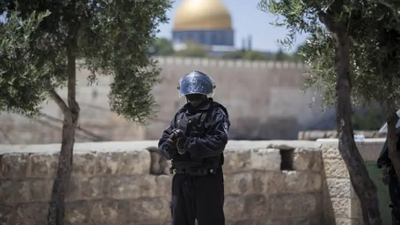 Police officer stands guard near Temple Mount