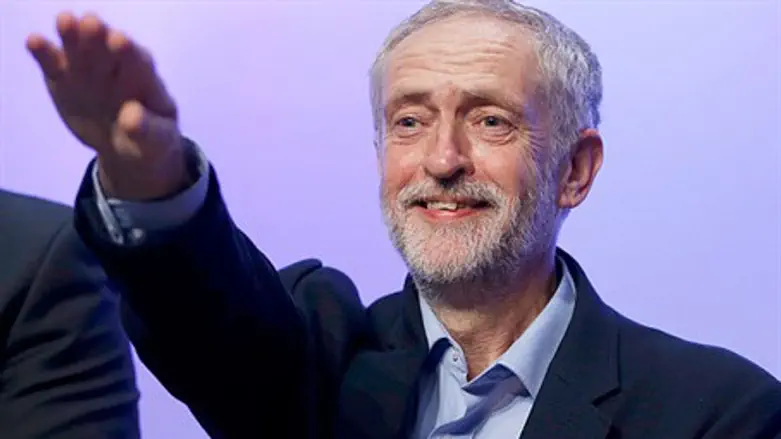 Labour party head Jeremy Corbyn waves to crowd