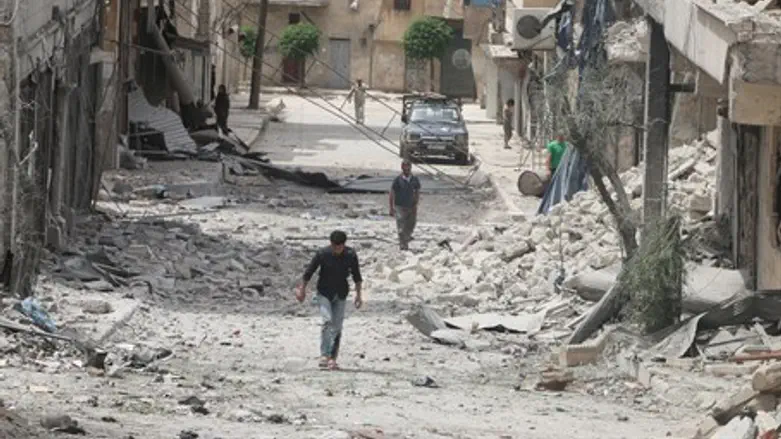 Residents walk through rubble in worn-torn Aleppo