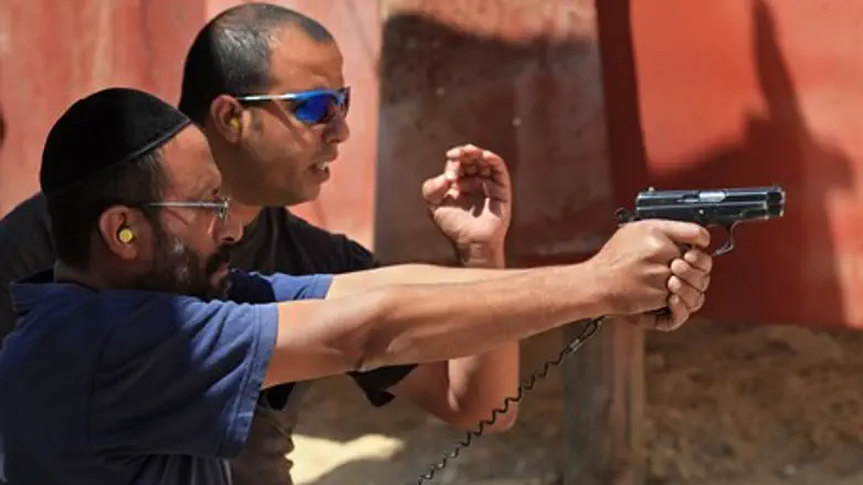 Israeli man trains at a shooting range