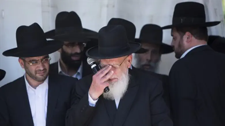 Rabbi Shalom Cohen fights back tears during his wife's funeral