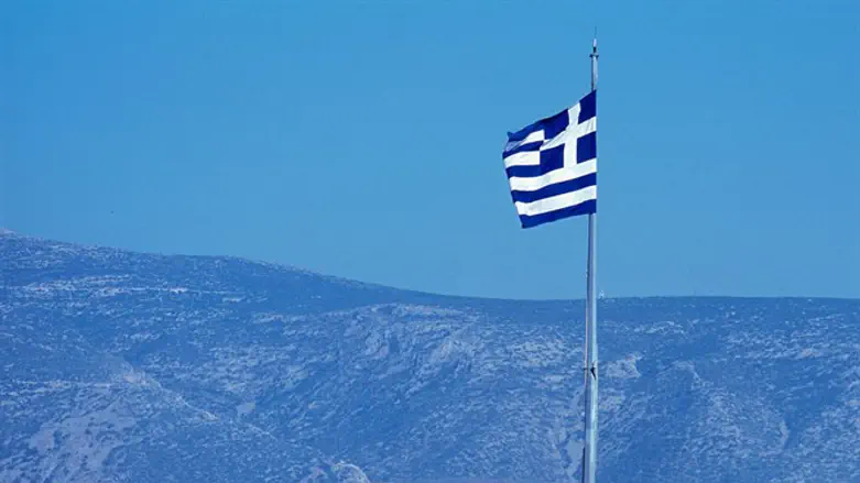 Flag of Greece flies atop Athens parliament building