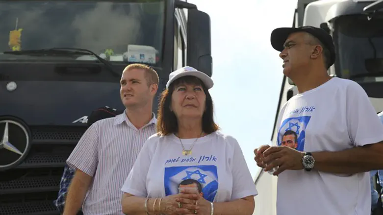 Family of Oron Shaul block t aid truck into Gaza during protest