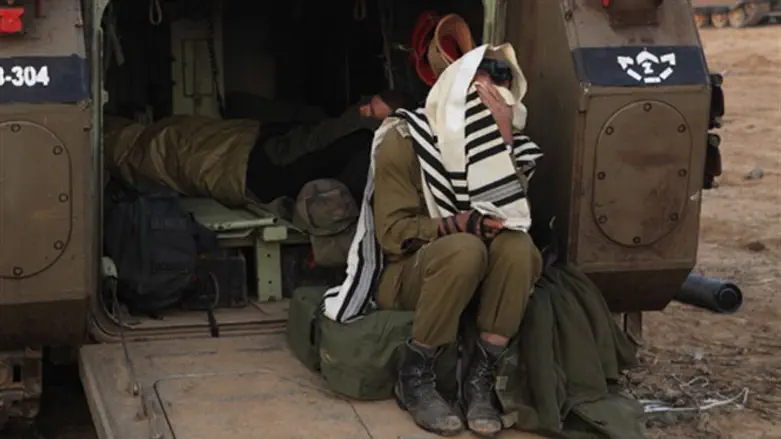 A religious soldier prays
