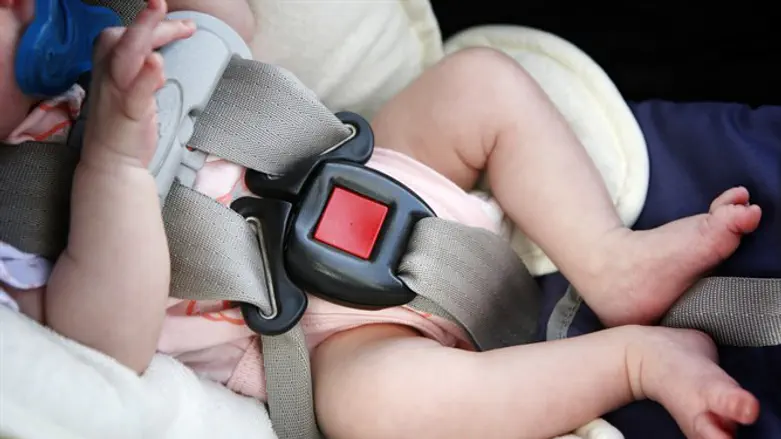 Baby in a car. Illustrative.