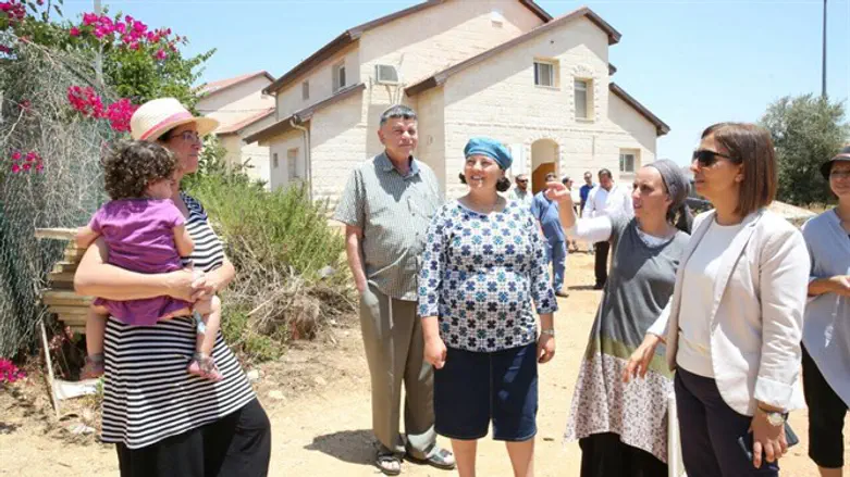 Minister Gamliel (right) in Amona, today.