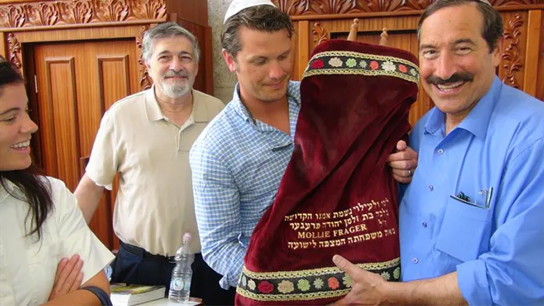 Pete Hegseth holds a Torah scroll with Dr. Joe Frager in Hevron