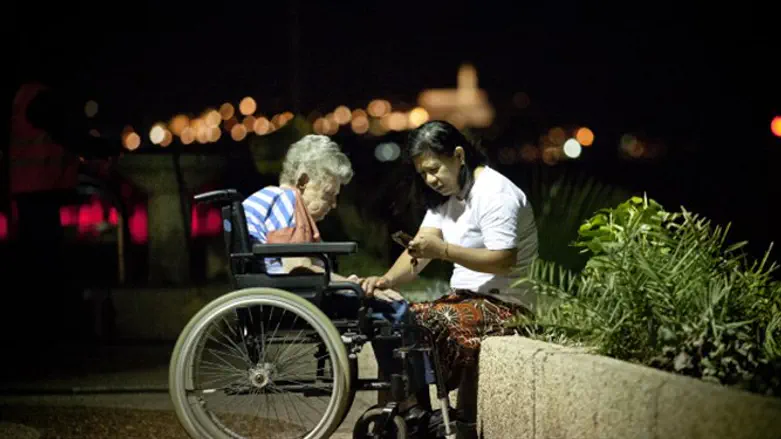 Elderly woman with caretaker in Tel Aviv