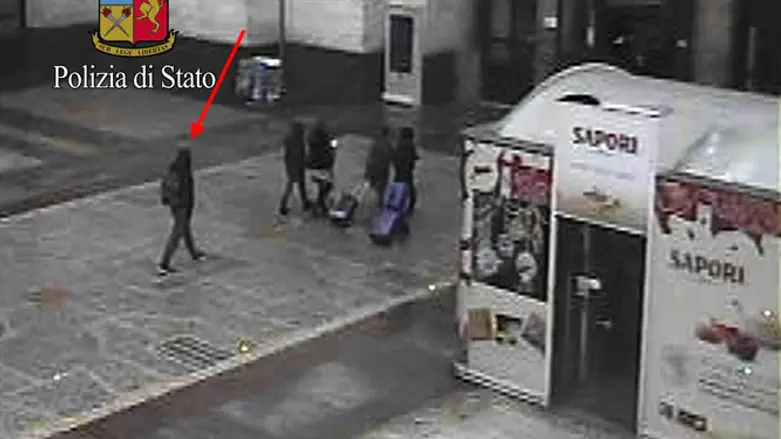 Anis Amri (L) in photo taken from security cameras at the Milan Central Train Station
