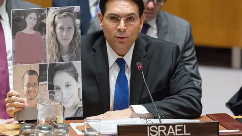 Danon with the pictures of the murdered soldiers