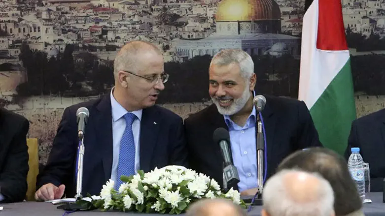 PA Prime Minister Rami Hamdallah and Hamas leader Ismail Haniyeh