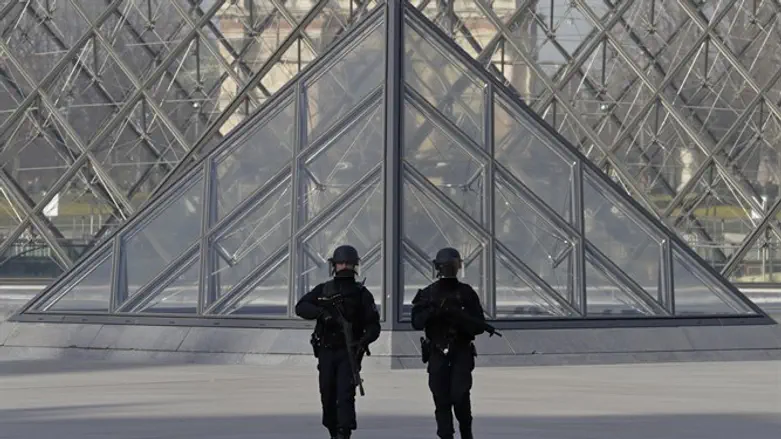 French police secure the site near the Louvre Pyramid