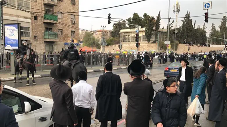 Haredi men protest at Bar Ilan Junction