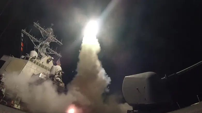 The USS Porter firing a Tomahawk missile at a Syrian military airfield in the Mediterranea