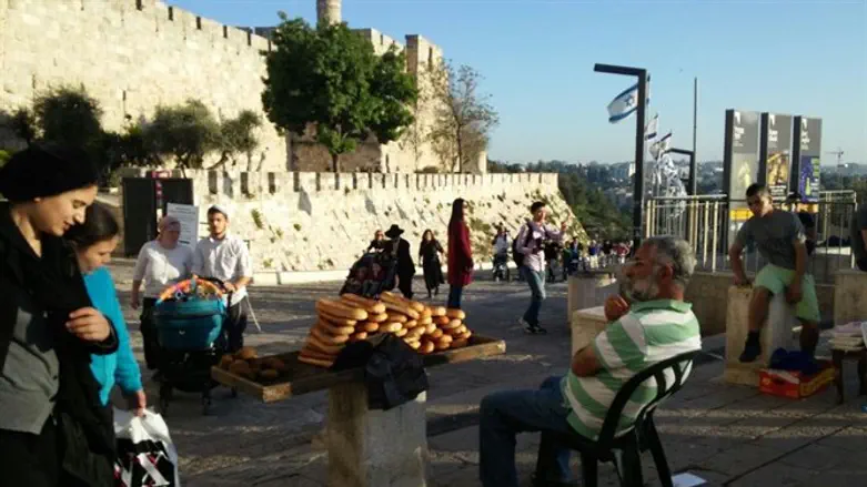 Selling bread at Jaffa Gate, Passover
