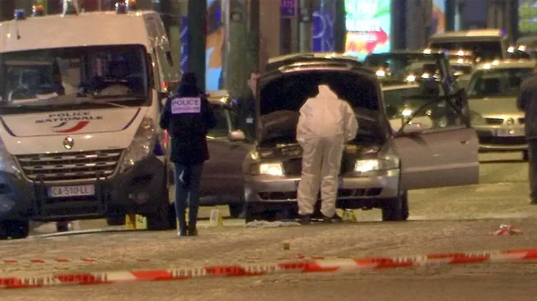 Police inspect car used by Champs Elysees shooter