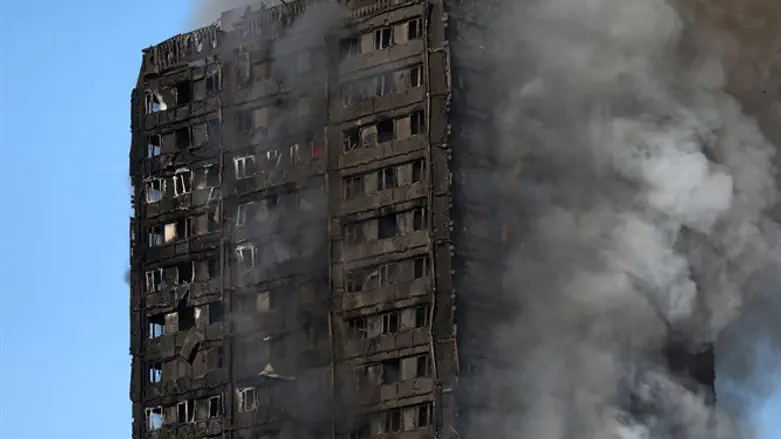 Grenfell Tower apartment building goes up in flames in London