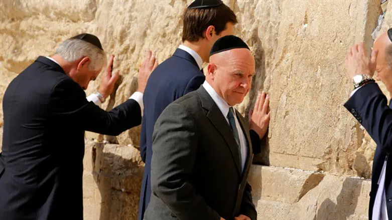 Beskullcapped McMaster rebuttons jacket after concluding business at Western Wall