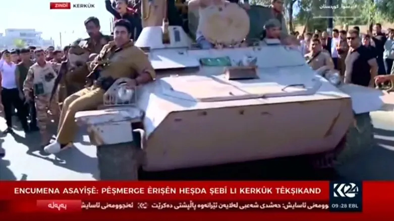 Kurd forces on armored vehicle in Kirkuk today