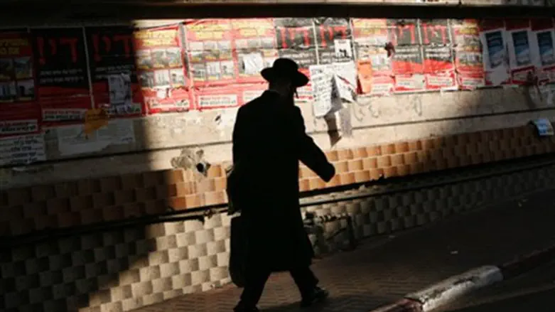 Man walks down street in Bnei Brak (stock)