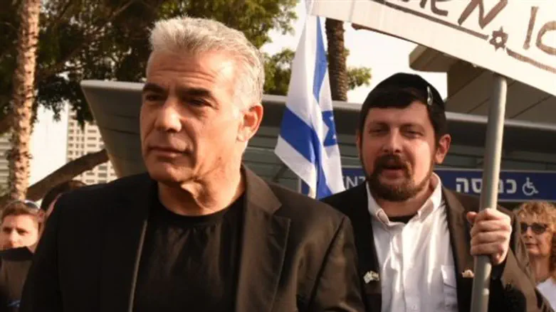 Lapid with the 'haredi' demonstrator