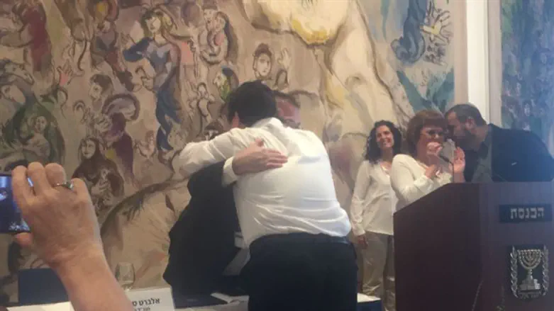Eliezer receives warm hug from Knesset Director