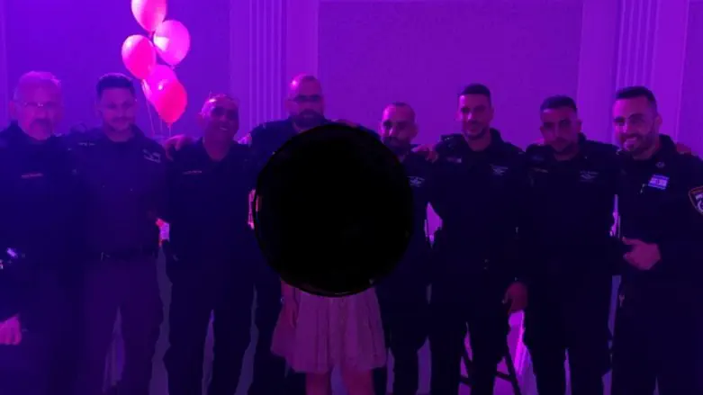 Police officers celebrate with bat mitzvah girl