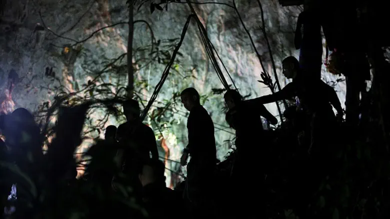 Military personnel are seen in front of the Tham Luang cave