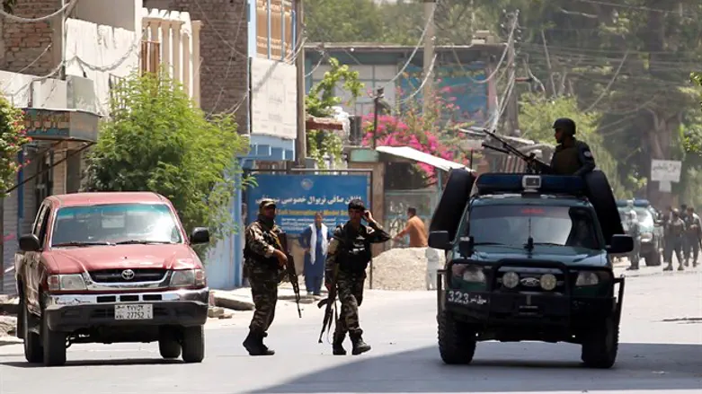 Afghan security forces arrive at area where explosions and gunshots heard