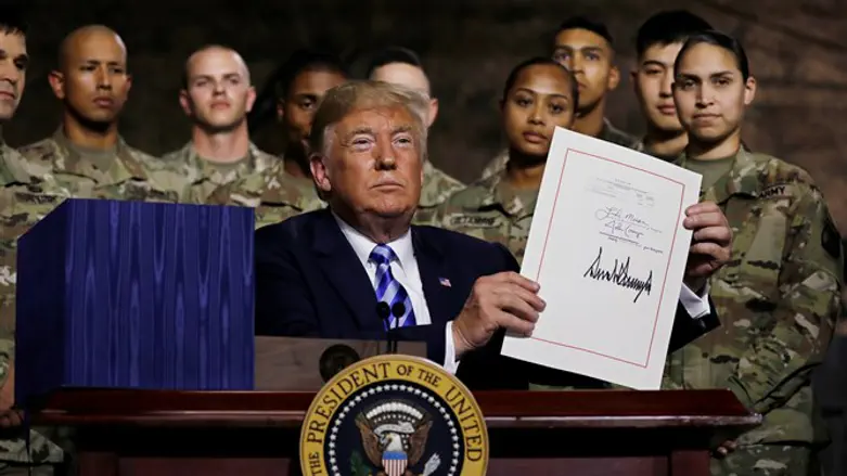 Trump holds up National Defense Authorization Act after signing it