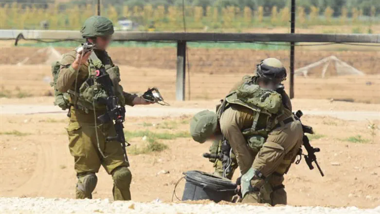 IDF specialists disposing of explosive devices along the Gaza border