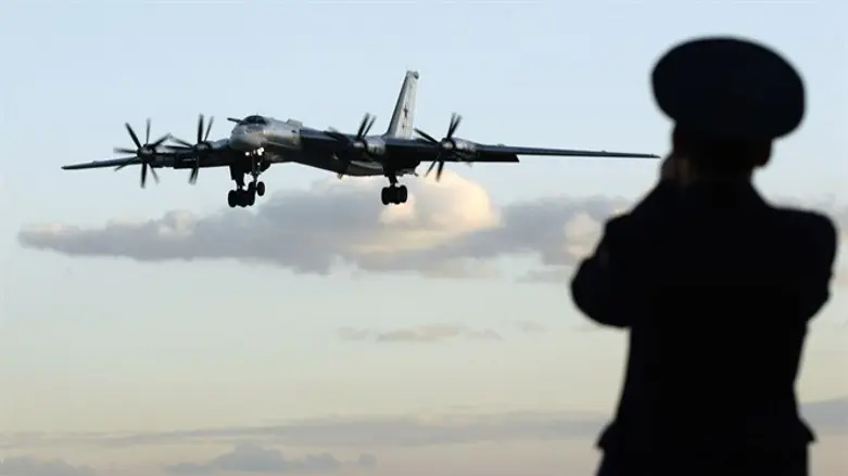 Russian officer takes picture of Tu-95 bomber