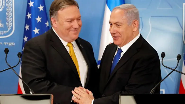 Israeli Prime Minister Binyamin Netanyahu shakes hands with U.S. Secretary of St
