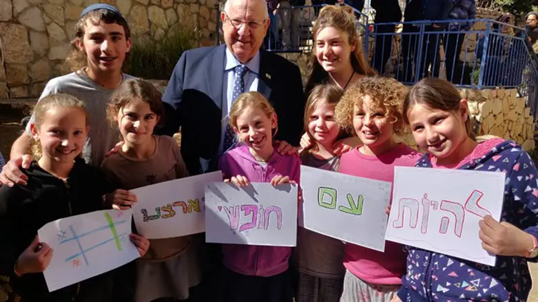 Rivlin with children from youth center