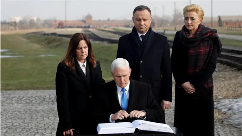 Pence signs visitors book at Auschwitz-Birkenau