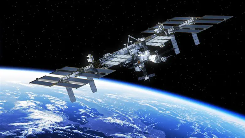 Международная космическая станция над Землей. Иллюстрация
